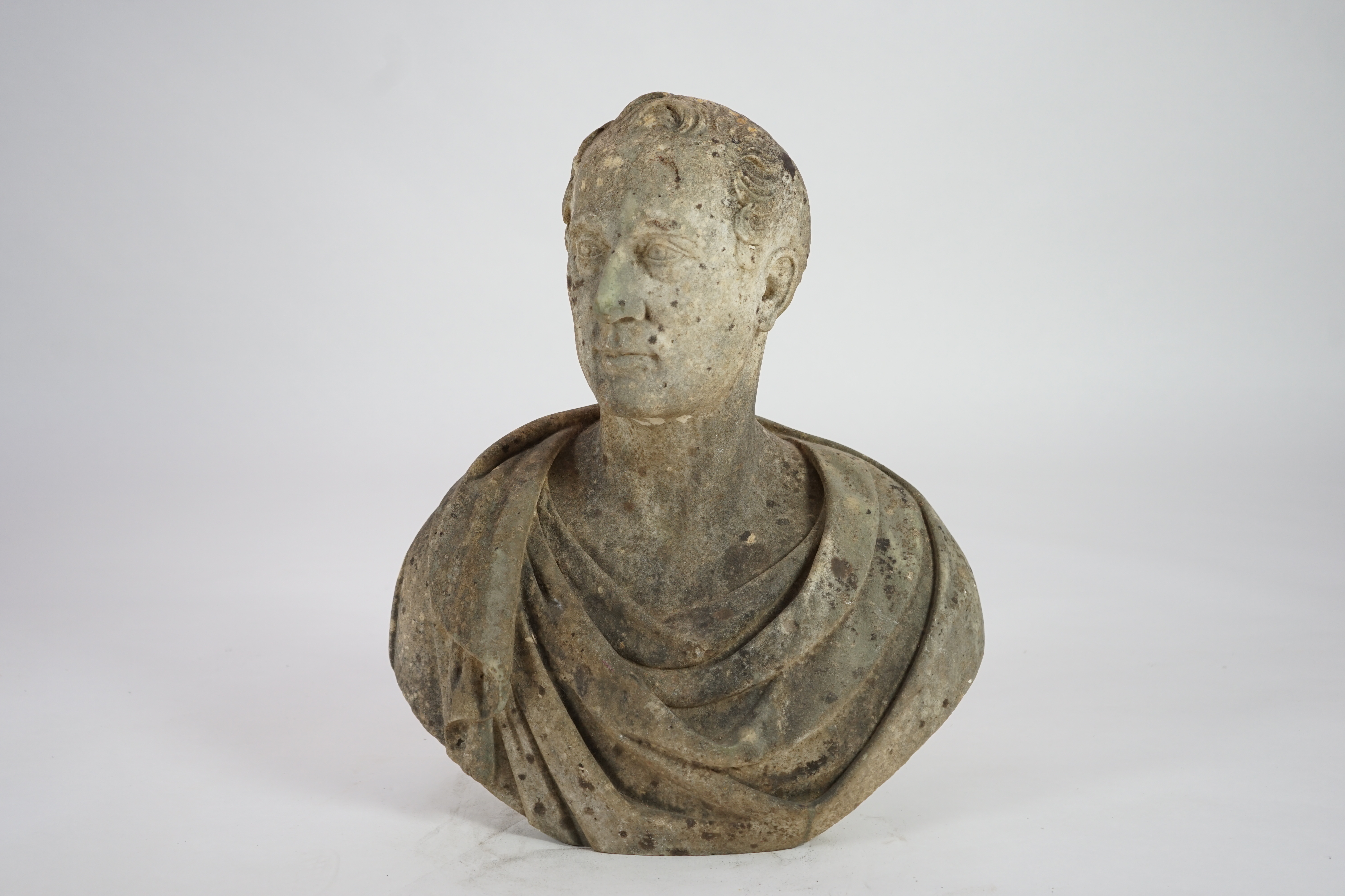 After Joseph Nollekens R.A. (1737-1823). A marble bust of a gentleman wearing classical robes